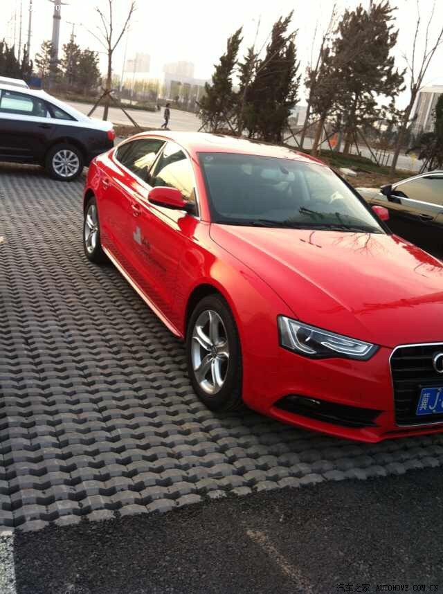 我们这4s店有辆红色门奥迪a5试驾车出售,36万